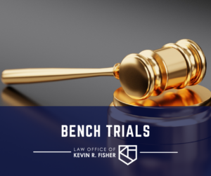 Gold colored gavel sitting on a wooden block. On the bottom portion of the image is a blue thick strip with the words "Bench Trials" in white. Below the words "Bench Trials" is the Kevin Fisher Legal logo.
