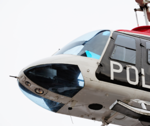White police helicopter against white sky background
